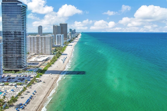 aerial view with a beach view and a water view