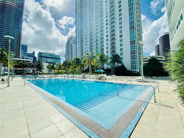 view of swimming pool featuring a patio