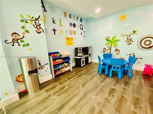 game room with hardwood / wood-style flooring