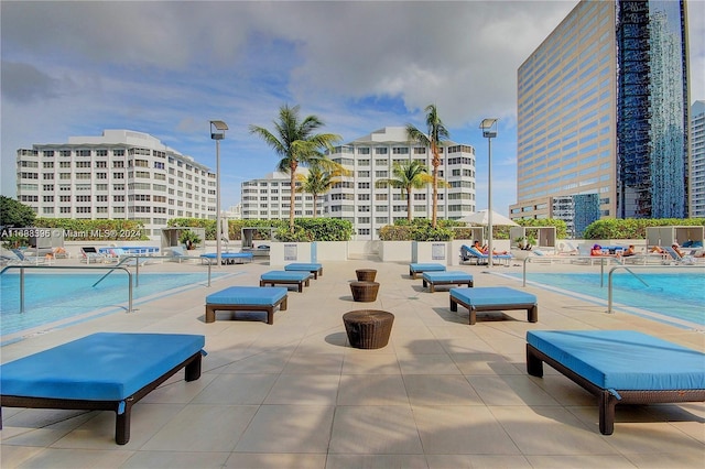 view of swimming pool with a patio