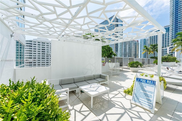 view of patio / terrace featuring outdoor lounge area and a pergola