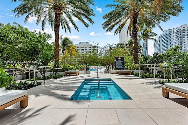 view of swimming pool with a patio area