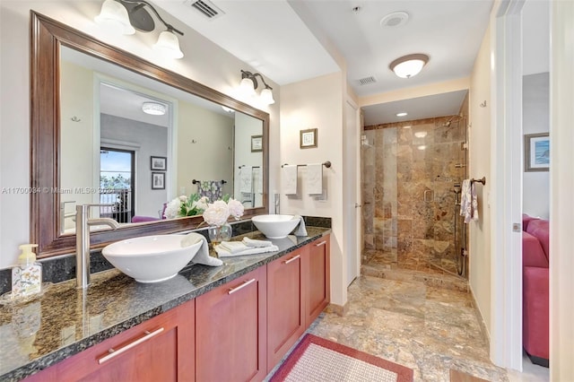 bathroom featuring vanity and walk in shower