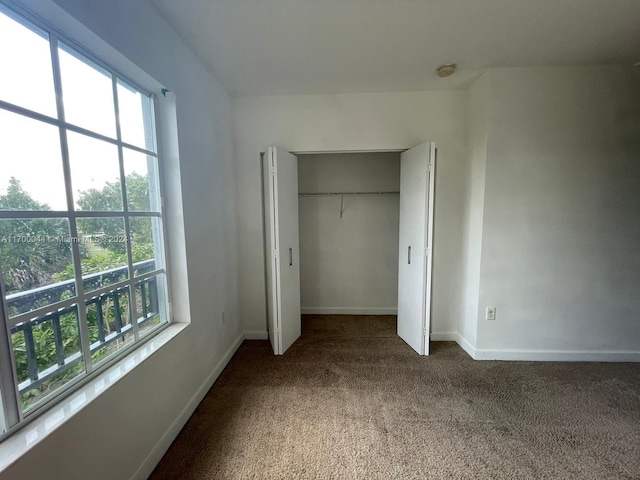 unfurnished bedroom with carpet flooring