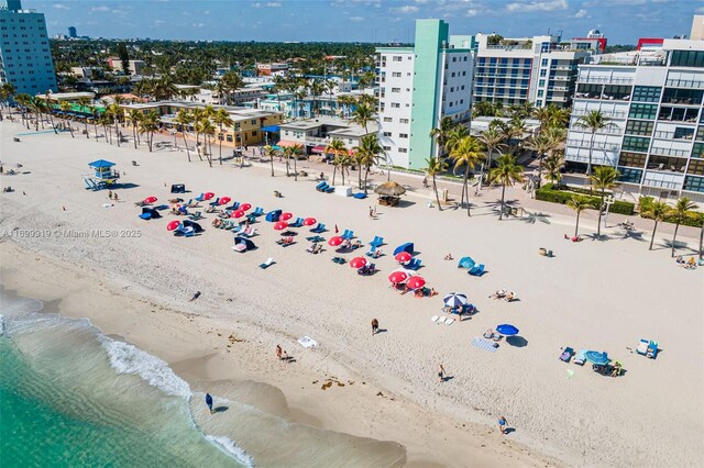 bird's eye view with a beach view and a water view