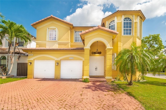 mediterranean / spanish-style home featuring a garage