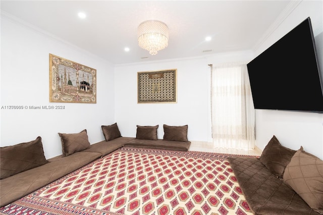 living room featuring a chandelier and crown molding