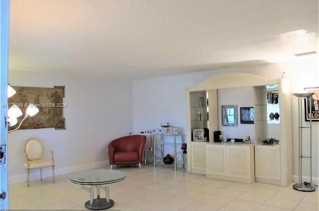 sitting room featuring light tile patterned floors