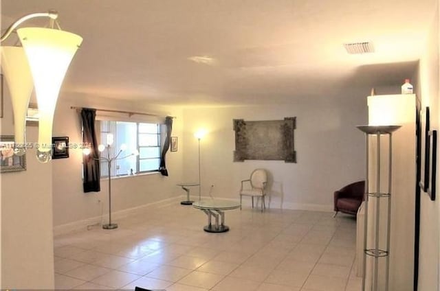 11960 NE 19th Dr Unit 24, North Miami, FL 33181 - interior space featuring light tile patterned flooring and baseboards