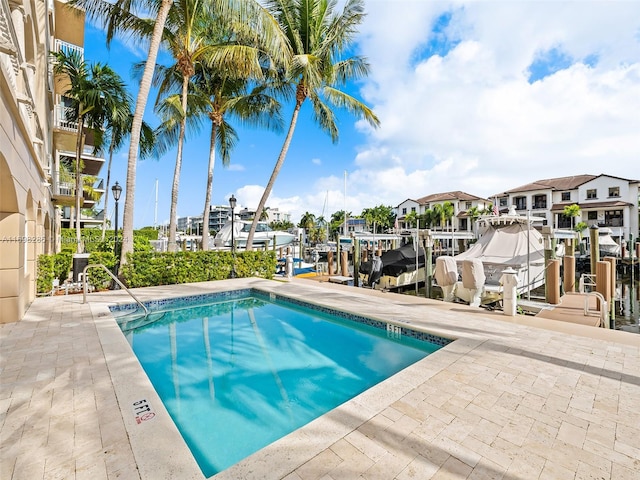 view of pool with a dock