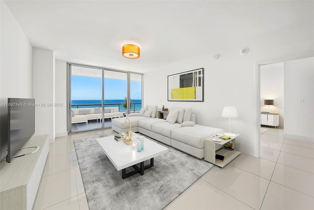 6799 Collins Ave Unit 1704, Miami Beach, FL 33141 - living room with expansive windows, light tile patterned floors, and a water view