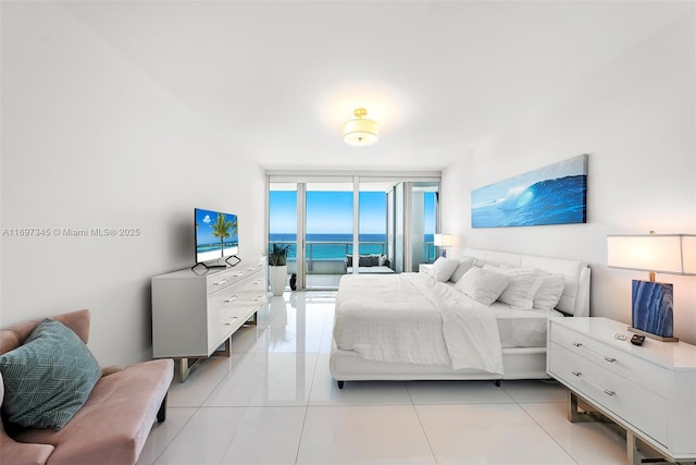 6799 Collins Ave Unit 1704, Miami Beach, FL 33141 - bedroom with floor to ceiling windows and light tile patterned floors