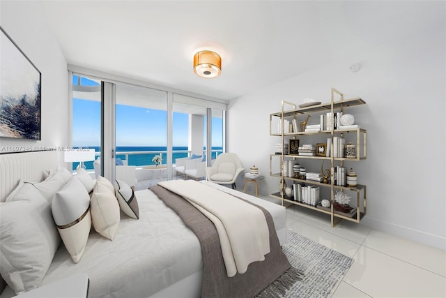 6799 Collins Ave Unit 1704, Miami Beach, FL 33141 - bedroom with tile patterned flooring and a water view