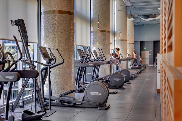 6799 Collins Ave Unit 1704, Miami Beach, FL 33141 - workout area featuring a towering ceiling and plenty of natural light