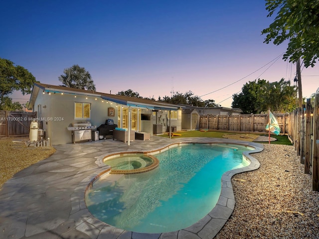 pool at dusk featuring an in ground hot tub, a patio area, and central air condition unit