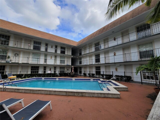 view of swimming pool featuring a patio area