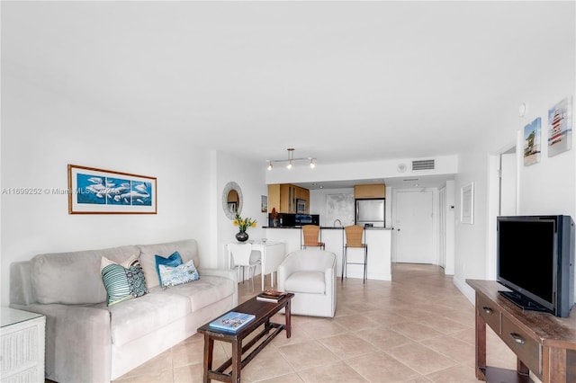 living room featuring light tile patterned floors