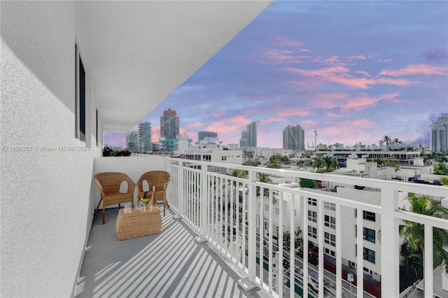 view of balcony at dusk