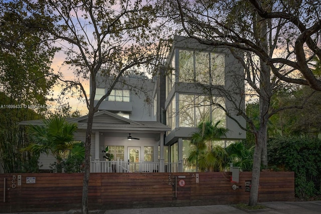 view of front of property featuring a fenced front yard and stucco siding