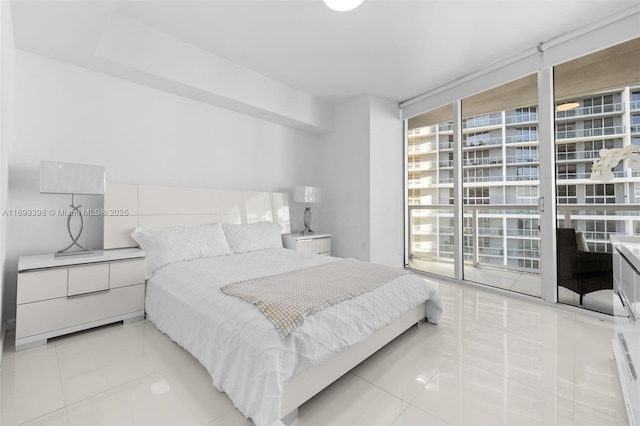 tiled bedroom featuring floor to ceiling windows and access to outside