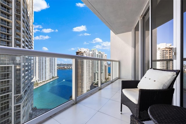 balcony featuring a water view