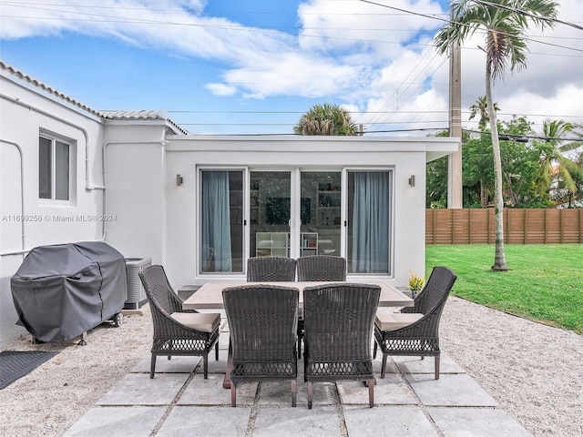 view of patio / terrace with central AC unit and area for grilling