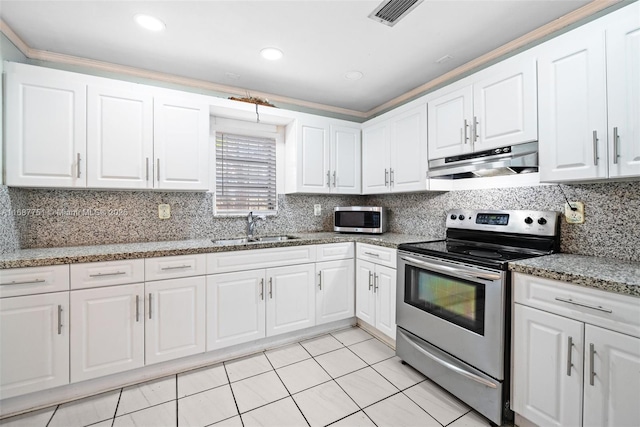 kitchen featuring visible vents, under cabinet range hood, white cabinets, stainless steel appliances, and a sink