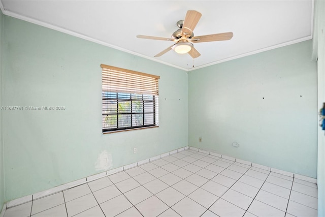spare room with ceiling fan and crown molding