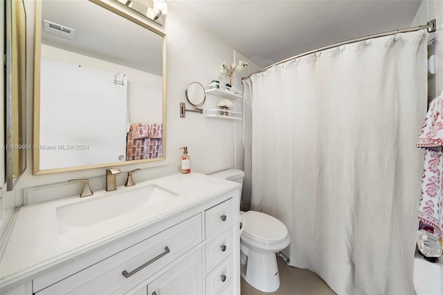 bathroom featuring vanity and toilet