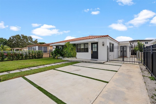 rear view of property with a yard