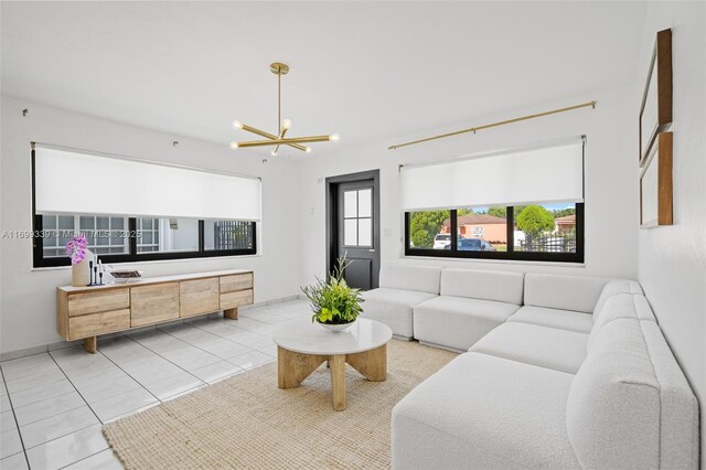 living room featuring light tile patterned floors and an inviting chandelier