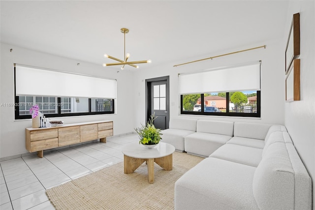 tiled living room featuring an inviting chandelier