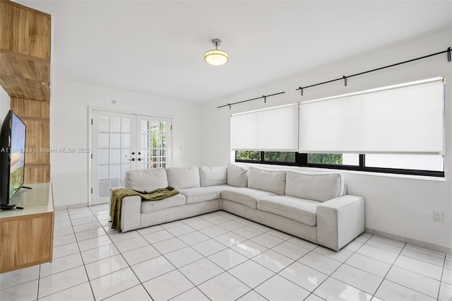 tiled living room featuring french doors