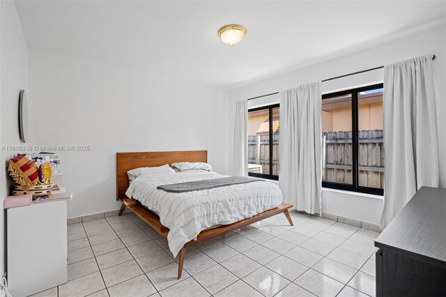 bedroom featuring light tile patterned floors