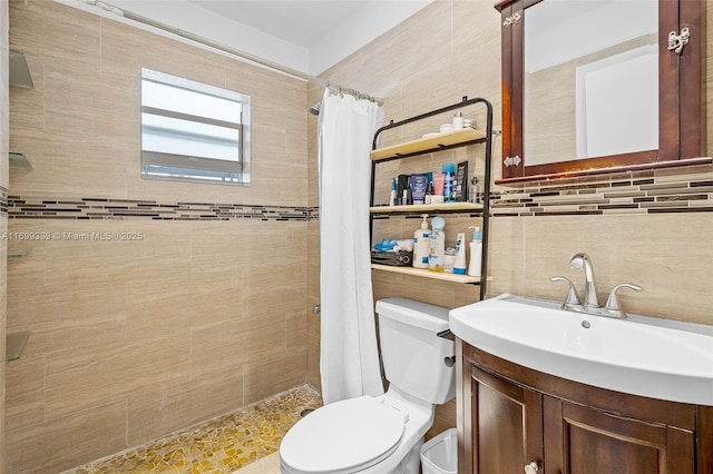 bathroom featuring toilet, vanity, tasteful backsplash, and a shower with curtain