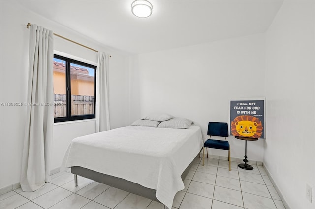 bedroom featuring light tile patterned flooring