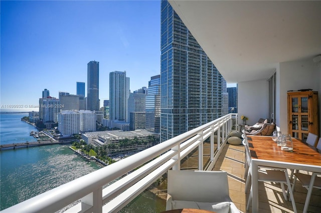 balcony featuring a water view