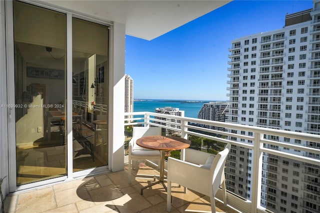 balcony featuring a water view