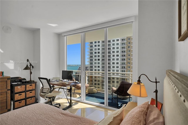 bedroom with floor to ceiling windows