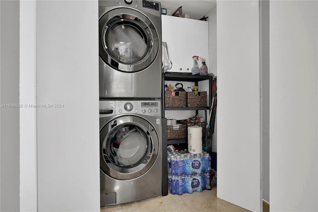 laundry area with stacked washer / dryer