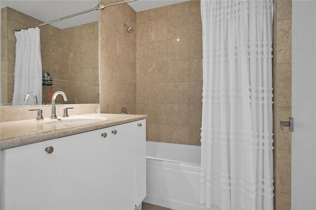 bathroom featuring vanity and shower / tub combo