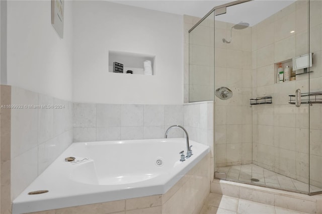 bathroom featuring tile patterned flooring and plus walk in shower