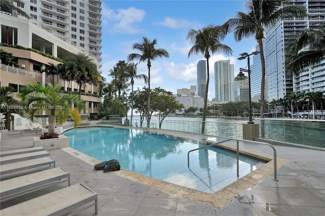 view of swimming pool with a patio area