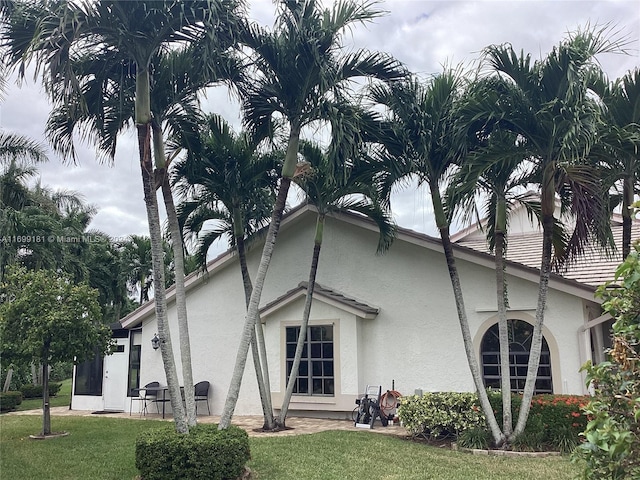 view of home's exterior with a yard