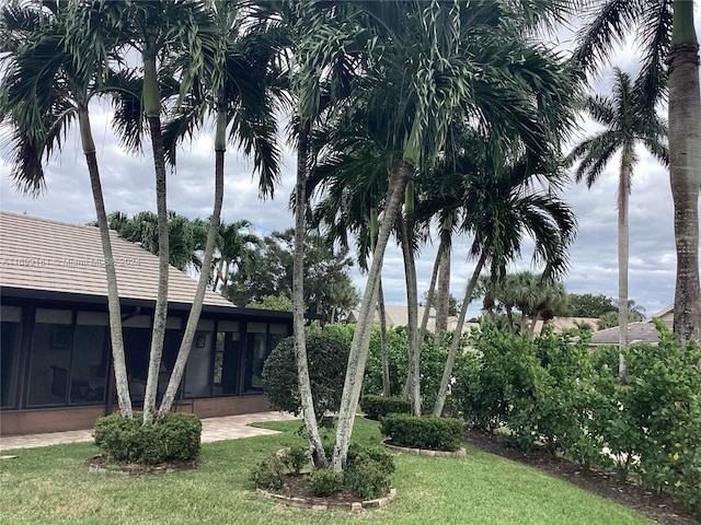 view of yard featuring a sunroom