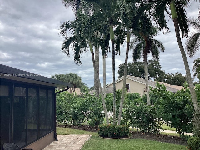 view of yard featuring a sunroom