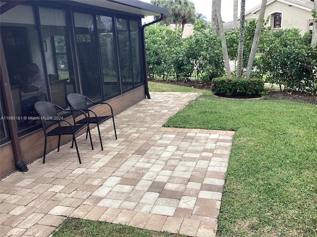 view of patio / terrace with a sunroom