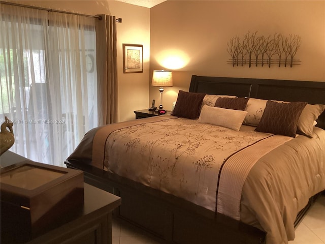 bedroom with light tile patterned floors