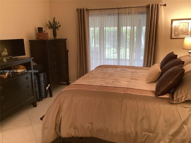 bedroom featuring light tile patterned floors