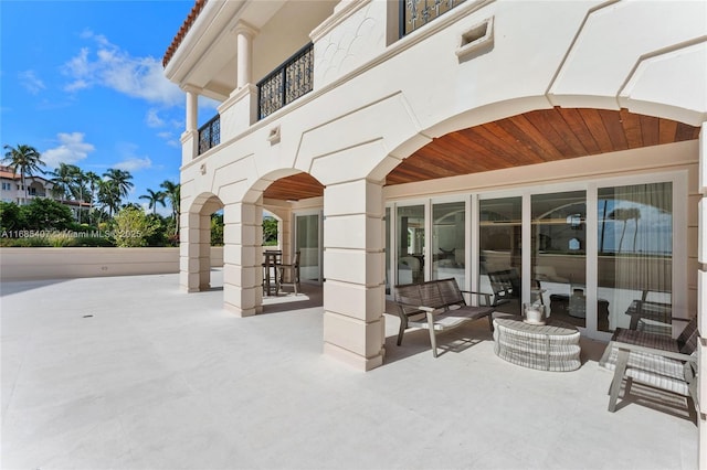 view of patio / terrace with a balcony